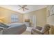 Comfortable bedroom with a ceiling fan and ample closet space at 2909 Old Orchard Ln, Parrish, FL 34219