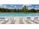 Relaxing community pool with lounge chairs at 2909 Old Orchard Ln, Parrish, FL 34219