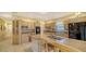 Large kitchen with ample cabinetry, an island, and a double sink at 2909 Old Orchard Ln, Parrish, FL 34219