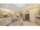 Well-equipped kitchen with island, breakfast bar and views into the Gathering room at 2909 Old Orchard Ln, Parrish, FL 34219