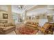 Open and airy living room with ample natural light and comfortable seating at 2909 Old Orchard Ln, Parrish, FL 34219