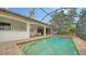 Sparkling pool with a covered patio and plenty of space for lounging at 2909 Old Orchard Ln, Parrish, FL 34219