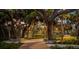 Lush garden walkway with ambient lighting at 1305 4Th St # 201E, Sarasota, FL 34236