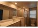 Clean bathroom with a large shower, double vanity, and updated fixtures at 11936 Sky Acres Ter, Bradenton, FL 34211