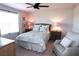 Cozy bedroom with a queen bed, nightstands, and a comfortable armchair at 11936 Sky Acres Ter, Bradenton, FL 34211