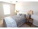 Serene bedroom featuring a plush bed, soft bedding, and ample natural light at 11936 Sky Acres Ter, Bradenton, FL 34211