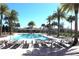 Resort-style pool with lounge chairs and palm trees at 11936 Sky Acres Ter, Bradenton, FL 34211