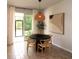 Dining area with round table, chairs, and sliding door access to patio at 11936 Sky Acres Ter, Bradenton, FL 34211