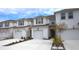 Two-story townhouses with attached garages and landscaping at 11936 Sky Acres Ter, Bradenton, FL 34211