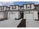 Two-story townhouse with attached garage and front landscaping at 11936 Sky Acres Ter, Bradenton, FL 34211