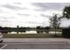 Community lake view with lush landscaping at 11936 Sky Acres Ter, Bradenton, FL 34211