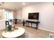 Bright living room features a large TV, comfortable seating, and stylish decor at 11936 Sky Acres Ter, Bradenton, FL 34211