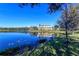 Beautiful lake view of a multi-story condo complex with large windows and scenic surroundings at 8922 White Sage Loop # 3001, Lakewood Ranch, FL 34202