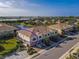 Aerial view of a townhome community with a lake at 7317 Skybird Rd # 7317, Bradenton, FL 34209