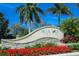 Community entrance sign with landscaping and palm trees at 7317 Skybird Rd # 7317, Bradenton, FL 34209