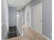 Upstairs hallway with light walls and wood-look flooring at 7317 Skybird Rd # 7317, Bradenton, FL 34209