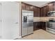 Stainless steel refrigerator in kitchen at 7317 Skybird Rd # 7317, Bradenton, FL 34209