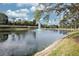 Serene pond with fountain, lush foliage, and palm trees at 7317 Skybird Rd # 7317, Bradenton, FL 34209