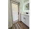 Modern bathroom with white cabinets and a lighted mirror at 4415 Barracuda Dr, Bradenton, FL 34208