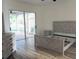 Main bedroom with wood-look floors and sliding glass doors at 4415 Barracuda Dr, Bradenton, FL 34208