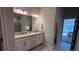 Double vanity bathroom with granite countertops at 2665 Ensenada Ln, North Port, FL 34286