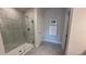 Modern bathroom with walk-in shower and tile flooring at 2665 Ensenada Ln, North Port, FL 34286