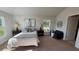 Main bedroom with carpeted floor and plenty of natural light at 2665 Ensenada Ln, North Port, FL 34286