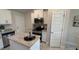 Modern kitchen with stainless steel appliances and granite countertops at 2665 Ensenada Ln, North Port, FL 34286