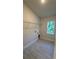Laundry room with tile floor and shelving for storage at 2665 Ensenada Ln, North Port, FL 34286