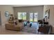 Comfortable living room with sliding glass doors leading to the backyard at 2665 Ensenada Ln, North Port, FL 34286