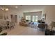 Open living and dining area with large windows and neutral colors at 2665 Ensenada Ln, North Port, FL 34286