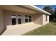 Covered patio with french doors at 2665 Ensenada Ln, North Port, FL 34286