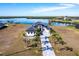 Luxury waterfront home with paver driveway, offering stunning water views at 5061 Collingswood Blvd, Port Charlotte, FL 33948