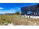 Covered patio with pool and lush landscaping at 5061 Collingswood Blvd, Port Charlotte, FL 33948