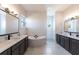 Bathroom with double vanity, soaking tub, and walk-in shower at 5061 Collingswood Blvd, Port Charlotte, FL 33948