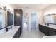 Spacious bathroom with double vanity, marble countertops, and large mirror at 5061 Collingswood Blvd, Port Charlotte, FL 33948