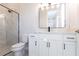 Modern bathroom with white cabinets and a walk-in shower at 5061 Collingswood Blvd, Port Charlotte, FL 33948