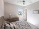 Serene bedroom with a dresser and large window at 5061 Collingswood Blvd, Port Charlotte, FL 33948