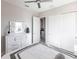 Spacious bedroom with white dresser and sliding door closet at 5061 Collingswood Blvd, Port Charlotte, FL 33948