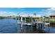 Expansive dock with multiple lifts and solar panels at 5061 Collingswood Blvd, Port Charlotte, FL 33948