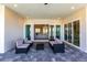 Covered patio with seating area and views of the pool and living room at 5061 Collingswood Blvd, Port Charlotte, FL 33948