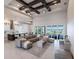 Open living room with sectional sofa, large windows, and water view at 5061 Collingswood Blvd, Port Charlotte, FL 33948