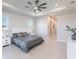 Main bedroom with large bed and ceiling fan at 5061 Collingswood Blvd, Port Charlotte, FL 33948