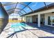 Large pool and spa with covered lanai and outdoor seating at 5061 Collingswood Blvd, Port Charlotte, FL 33948