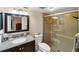 Modern bathroom featuring vanity with granite counter and walk-in shower at 445 Palm Tree Dr, Bradenton, FL 34210