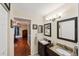 Bright and airy bathroom featuring double sinks and a closet at 445 Palm Tree Dr, Bradenton, FL 34210