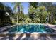 Community pool with clear water and ample lounging space at 445 Palm Tree Dr, Bradenton, FL 34210