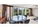 Cozy dining area featuring a glass table and a view to the outdoors at 445 Palm Tree Dr, Bradenton, FL 34210