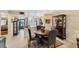 Cozy dining area with elegant lighting and seamless transition into the modern kitchen at 445 Palm Tree Dr, Bradenton, FL 34210