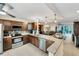 Bright kitchen with stainless steel appliances, granite countertops, and seamless view into living area at 445 Palm Tree Dr, Bradenton, FL 34210